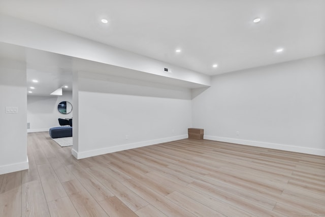 basement featuring light wood-type flooring