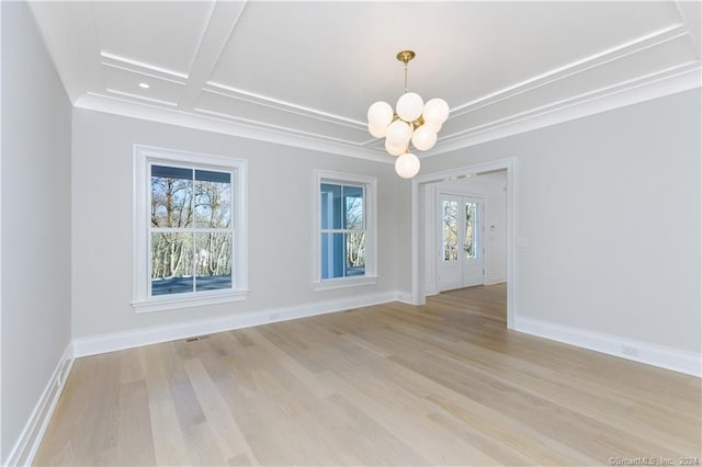 unfurnished dining area featuring a wealth of natural light, a chandelier, light hardwood / wood-style floors, and coffered ceiling