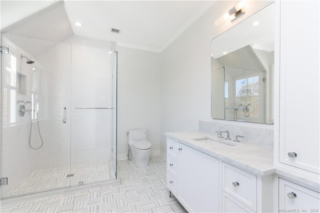 bathroom with ornamental molding, walk in shower, vanity, and toilet