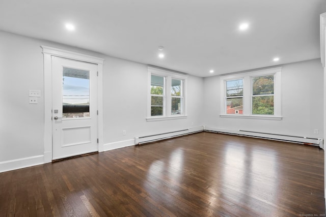 entrance foyer featuring baseboard heating and dark wood-type flooring