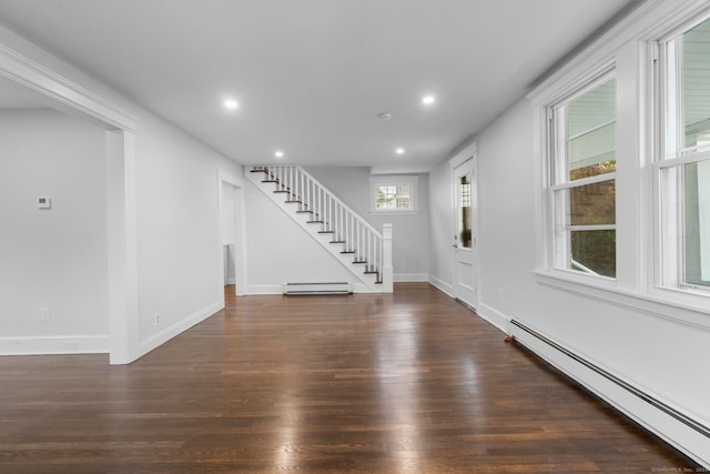 entrance foyer featuring a baseboard radiator and dark hardwood / wood-style flooring