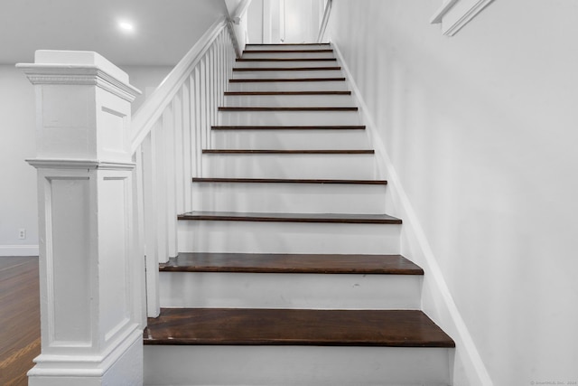 stairs with wood-type flooring