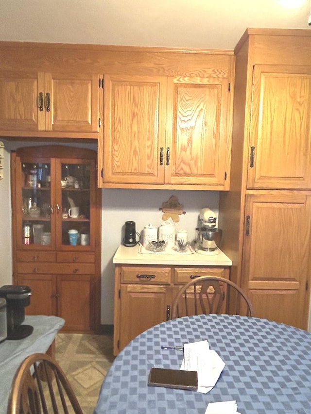 14 8th St, Newington, CT 06111 - kitchen featuring light countertops and brown cabinetry