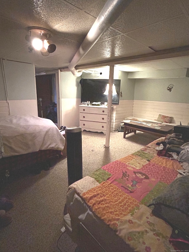 bedroom featuring ceiling fan and carpet