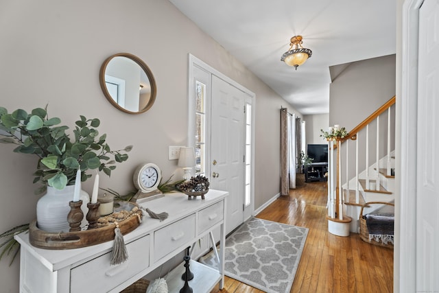 foyer entrance with hardwood / wood-style floors