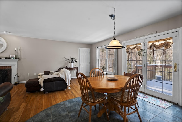 dining room with hardwood / wood-style floors and a healthy amount of sunlight