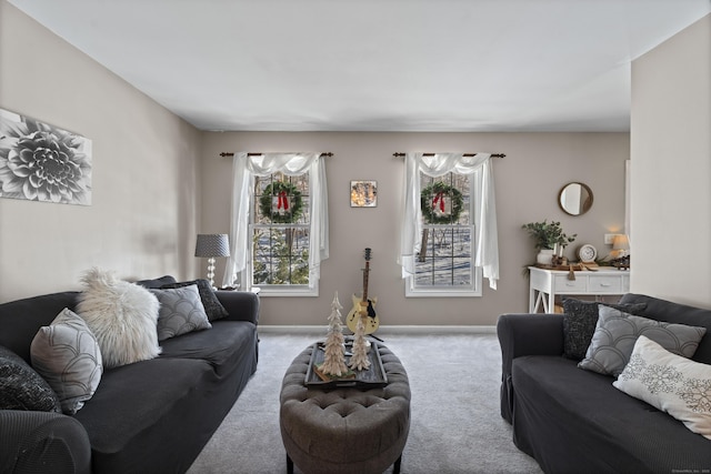 living room featuring plenty of natural light and light colored carpet