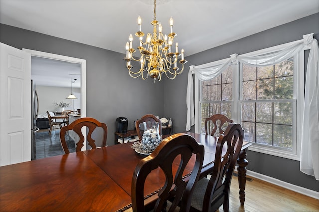 dining room featuring a chandelier and hardwood / wood-style floors