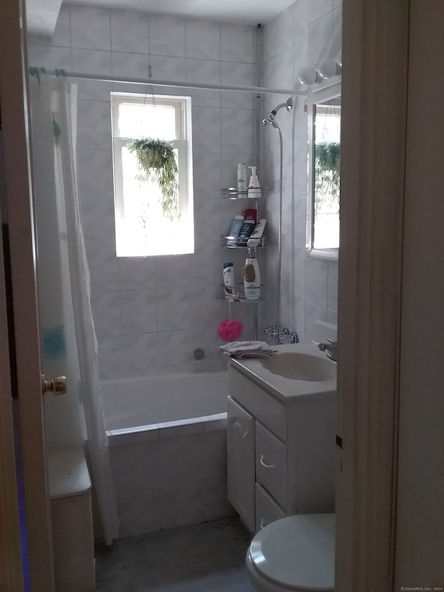 bathroom featuring walk in shower, vanity, and toilet