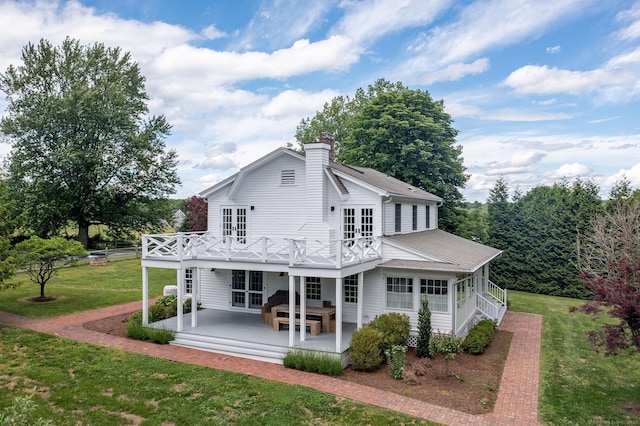 429 Chestnut Land Rd, New Milford, CT 06776 - rear view of property featuring french doors, a yard, a patio area, and a chimney