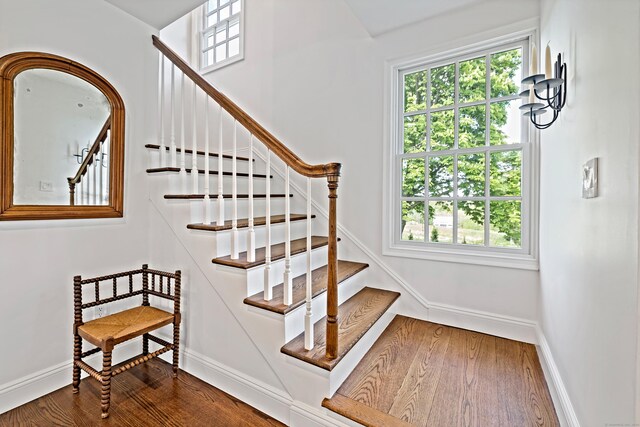 429 Chestnut Land Rd, New Milford, CT 06776 - stairs featuring wood finished floors and baseboards