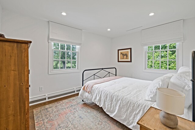 429 Chestnut Land Rd, New Milford, CT 06776 - bedroom with recessed lighting, multiple windows, a baseboard heating unit, and wood finished floors
