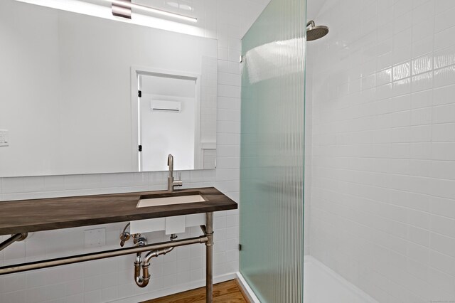 429 Chestnut Land Rd, New Milford, CT 06776 - full bath featuring a sink, a tile shower, and a wall mounted air conditioner
