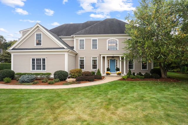 view of front of property with a front lawn