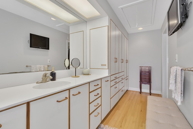 bathroom featuring vanity and hardwood / wood-style flooring