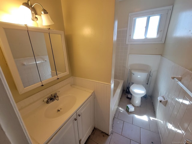 bathroom featuring vanity, tile patterned floors, and toilet