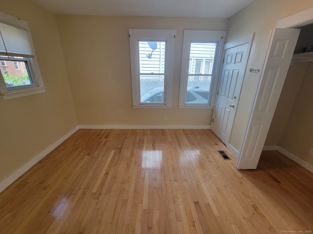 unfurnished room featuring light hardwood / wood-style flooring