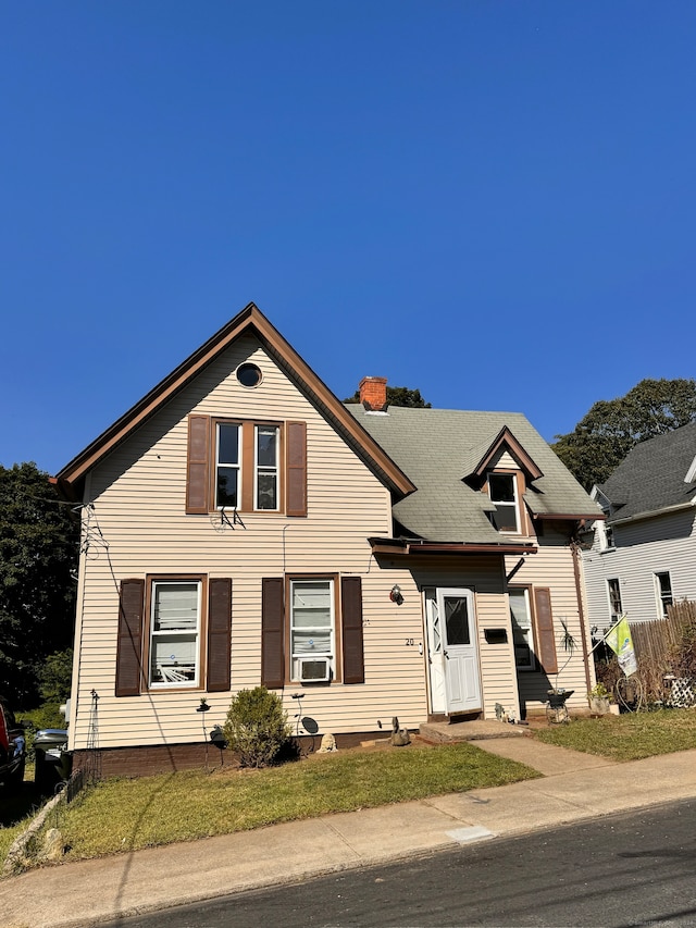 view of front of home with a front lawn