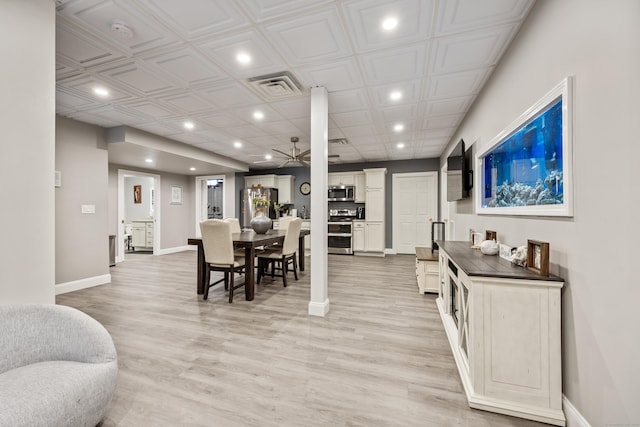 dining room with light wood-type flooring