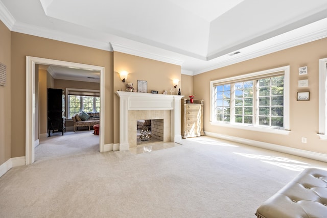 unfurnished living room featuring light carpet, crown molding, and a tile fireplace