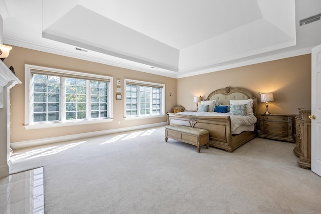 bedroom with light carpet, a raised ceiling, and crown molding