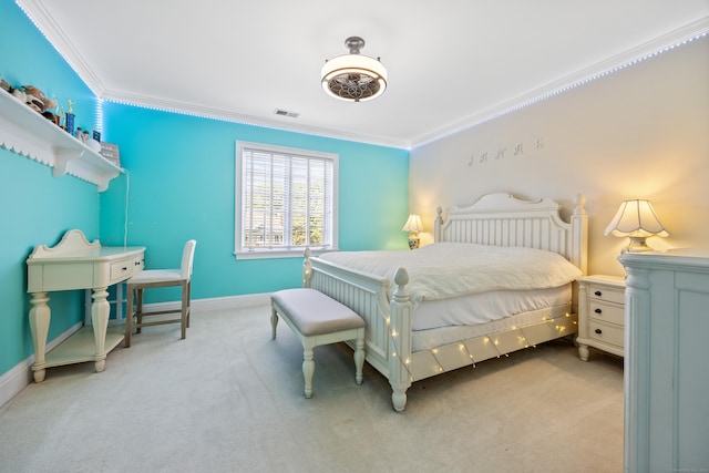 bedroom featuring crown molding, ceiling fan, and light colored carpet