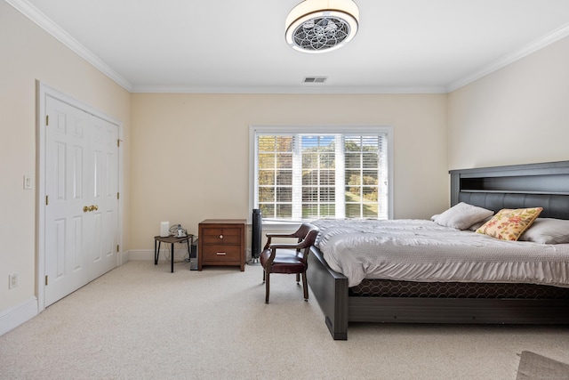 carpeted bedroom with ornamental molding