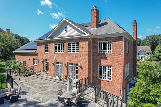 back of house with a patio area