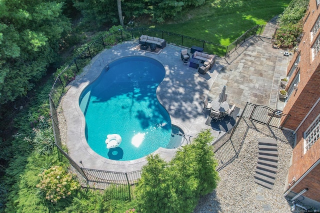 view of swimming pool featuring outdoor lounge area and a patio