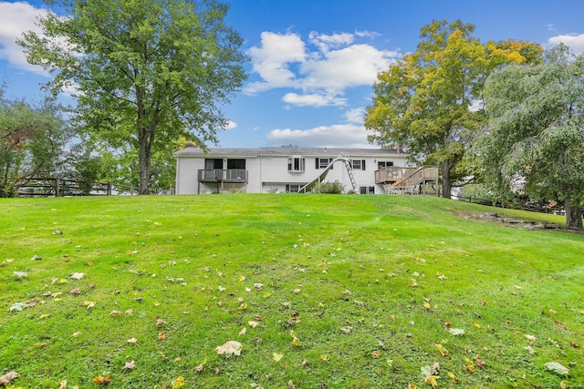 back of property featuring a lawn