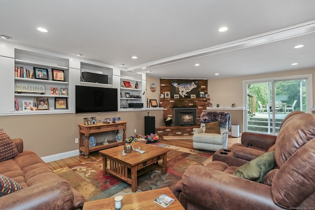 living room featuring hardwood / wood-style flooring and a fireplace