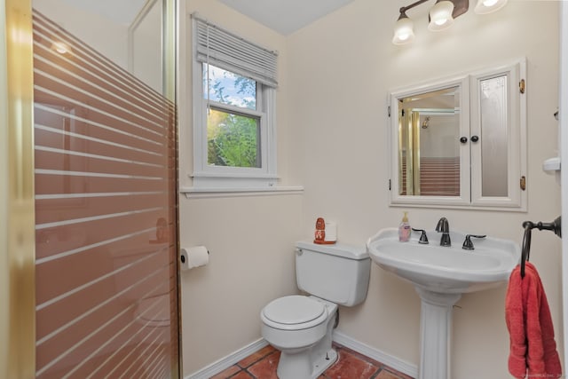 bathroom featuring tile patterned flooring and toilet