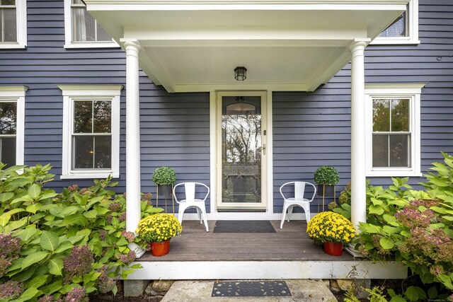 view of exterior entry featuring a porch