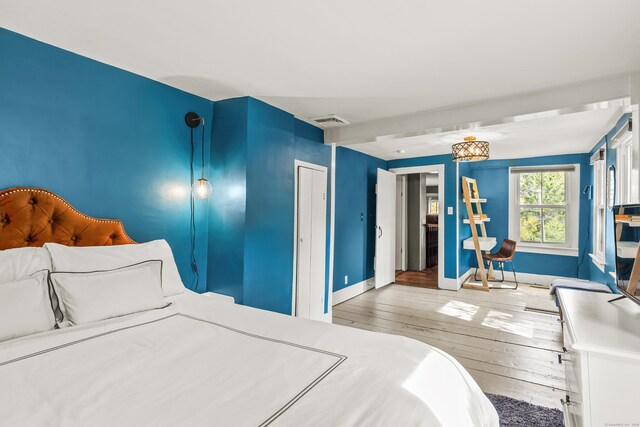 bedroom featuring hardwood / wood-style flooring