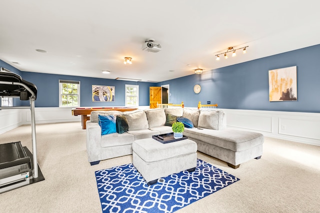 carpeted living room with pool table