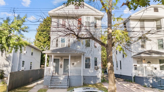 view of front of home with cooling unit and a porch