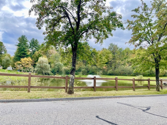 view of gate featuring a water view