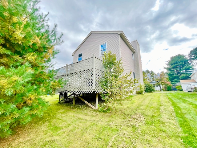 rear view of house with a lawn