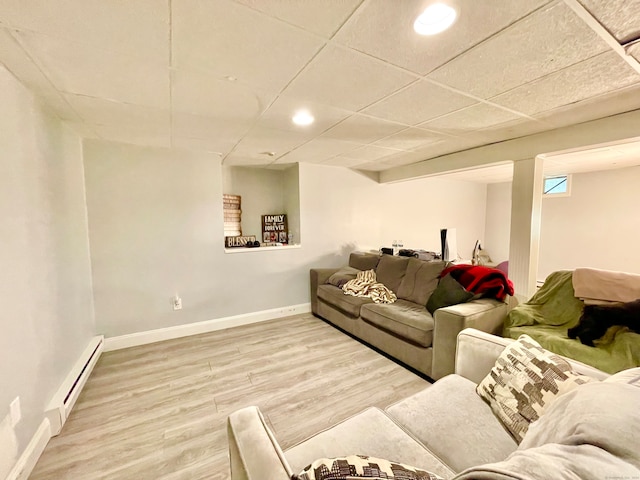 living room with hardwood / wood-style flooring and baseboard heating