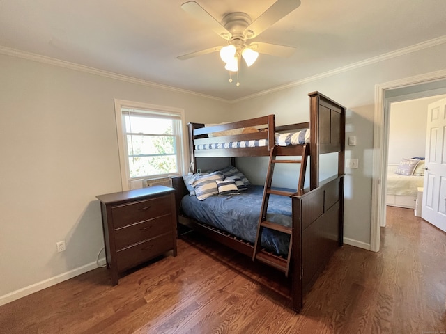 bedroom with ceiling fan, dark hardwood / wood-style floors, and crown molding