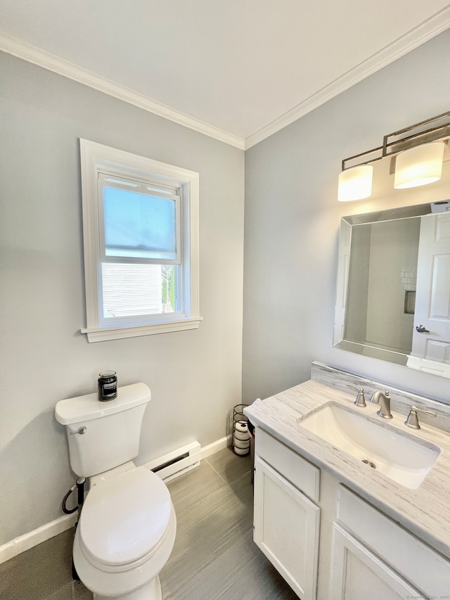 bathroom with crown molding, baseboard heating, vanity, and toilet