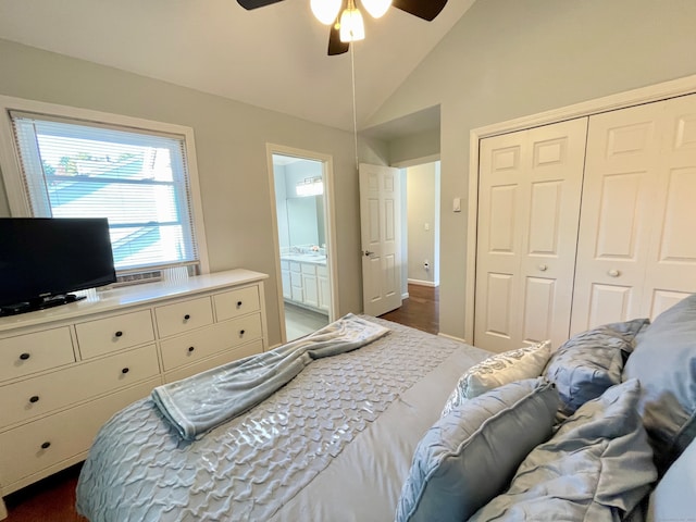 bedroom featuring ceiling fan, dark wood-type flooring, a closet, vaulted ceiling, and ensuite bath