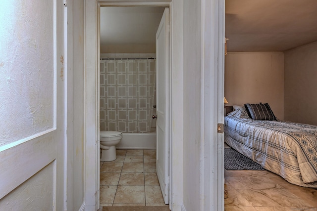 bathroom featuring tile patterned floors and toilet