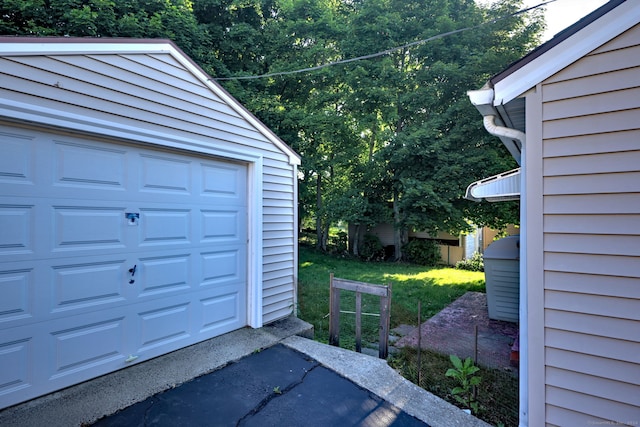 garage featuring wooden walls