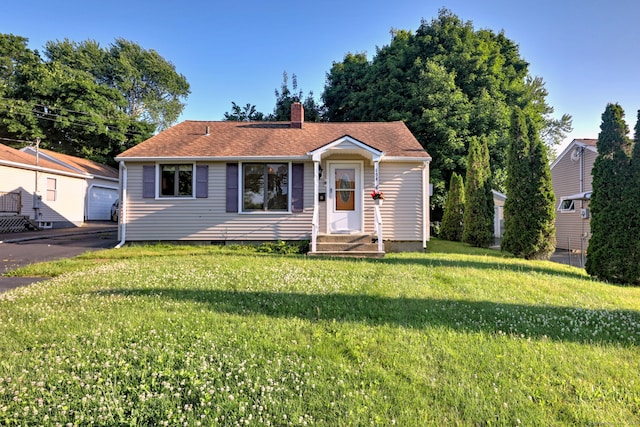 view of front of home with a front lawn