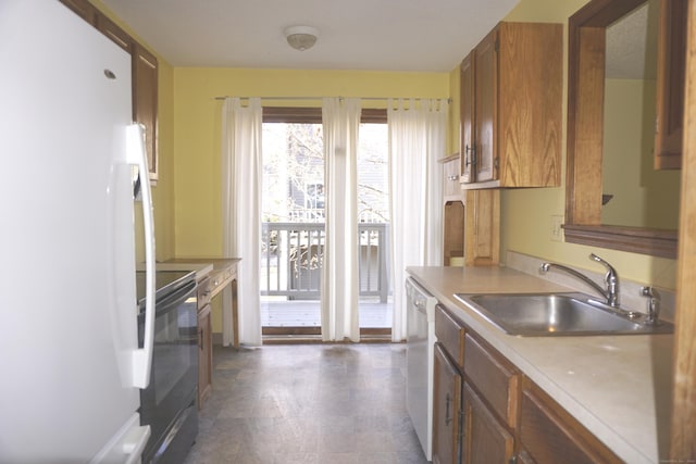 kitchen with white appliances and sink