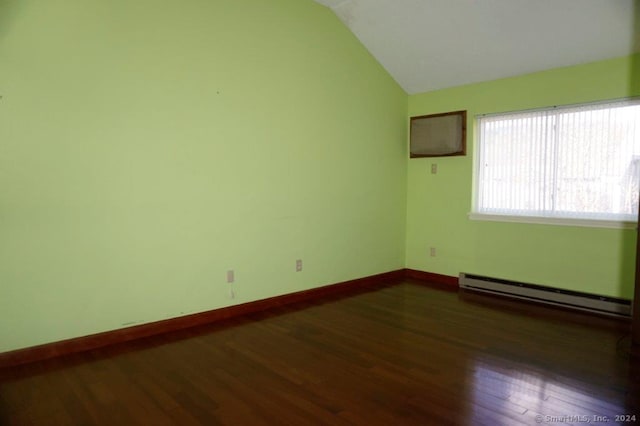 unfurnished room with dark wood-type flooring, lofted ceiling, and a baseboard heating unit