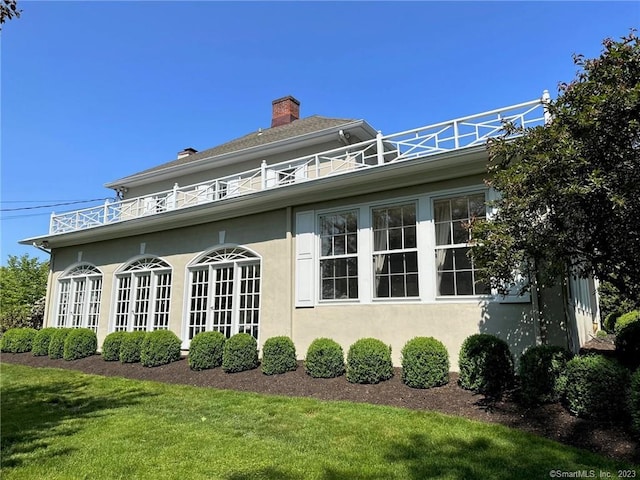 view of home's exterior featuring a yard