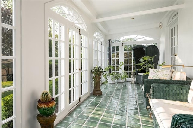 sunroom featuring french doors and beamed ceiling