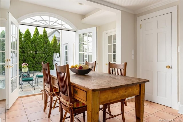 sunroom / solarium featuring french doors and a healthy amount of sunlight